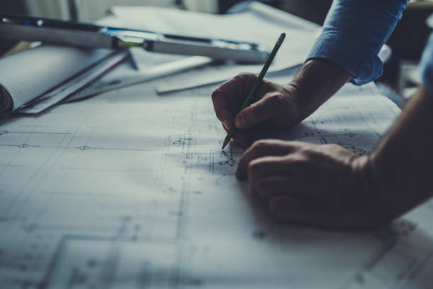 Consultant marking up a facility drawing while developing a church security plan